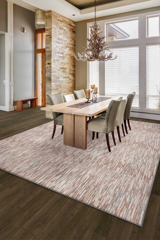 red patterned area rug under dining room table in rustic chic home